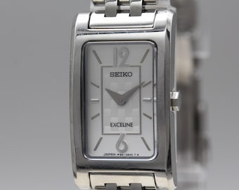 VS: Invoerrechten vooraf betaald en inbegrepen. Geen extra kosten na het afrekenen. Vintage 2002 N Mint SEIKO Exceline 1F20-0AN0 Tank Quartz dameshorloge JAPAN