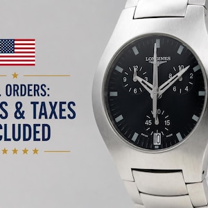 May include: A silver-toned stainless steel chronograph wristwatch with a black dial, featuring three sub-dials, luminous hour markers, a date window at the six o'clock position, and a metal link bracelet with a brushed finish.