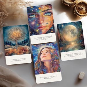 May include: Four rectangular oracle cards featuring vibrant, detailed illustrations of a cosmic face, a glowing tree, a moonlit forest, and a person looking upward. Each card includes white text at the bottom with inspirational quotes.