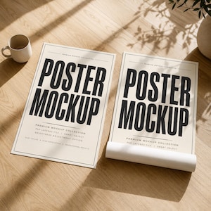 May include: Two rectangular posters with cream-colored backgrounds and bold black text reading POSTER MOCKUP. One poster lies flat, while the other is partially rolled at the bottom. Both feature additional small text detailing premium collection features.