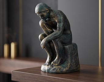 A Cast Iron Sculpture Of The Thinker 16 cm
