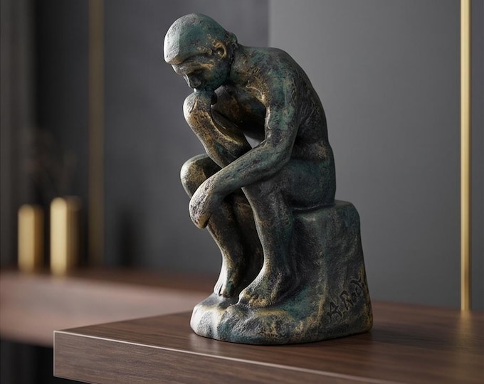 A Cast Iron Sculpture Of The Thinker 16 cm