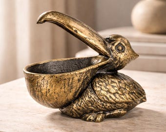 A Cast Iron Sculpture Of A Pelican 15 cm