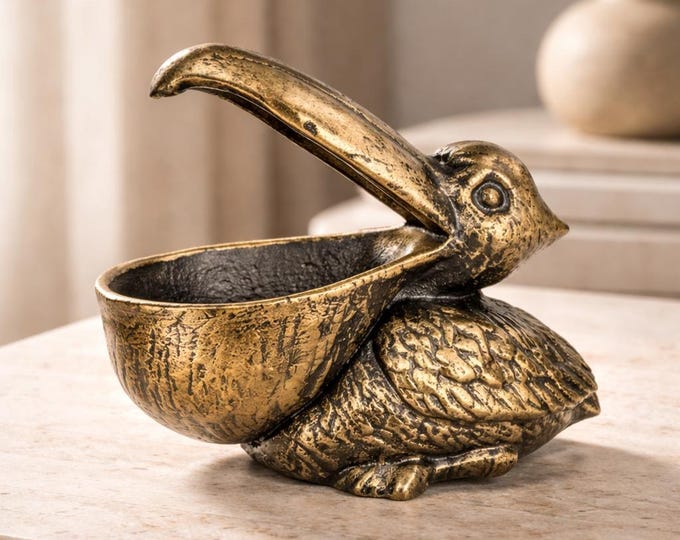 A Cast Iron Sculpture Of A Pelican 15 cm