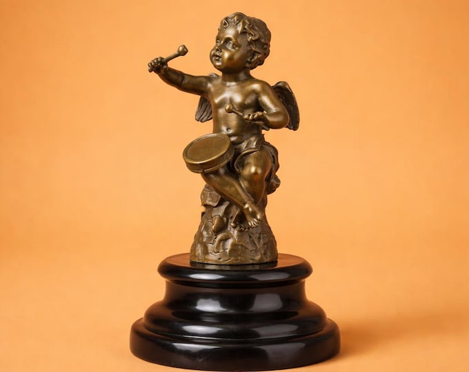 A Bronze Sculpture of An Angel Playing A Drum 18cm
