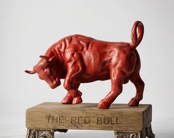A Cast Iron Bull Mounted On Wooden Base "The Red Bull" 19cm