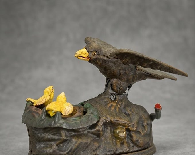 A Cast Iron Eagle Feeding her Eaglets Mechanical Bank 15cm
