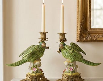 A Pair Of Brass Mounted Porcelain Parrot Candle Holders 28cm