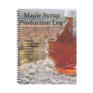 May include: A spiral-bound notebook titled "Maple Syrup Production Log" with a maple leaf-shaped bottle of syrup. The notebook is designed for tracking weather, sap collection, tree tapping, boiling, expenses, and income.
