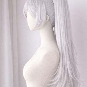 May include: A light gray wig styled with a high ponytail and side bangs, displayed on a mannequin. The wig has long, straight hair that cascades down the back. The mannequin is set against a white backdrop.