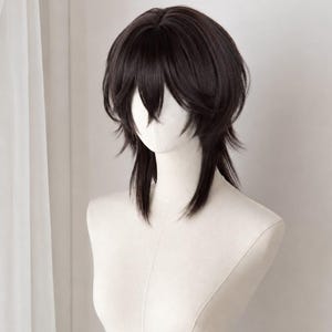 May include: A dark brown wig featuring a layered, shaggy cut with face-framing bangs and longer, wispy sections at the nape of the neck. The hair is styled with volume at the crown and straight, textured ends that fall around the shoulders.