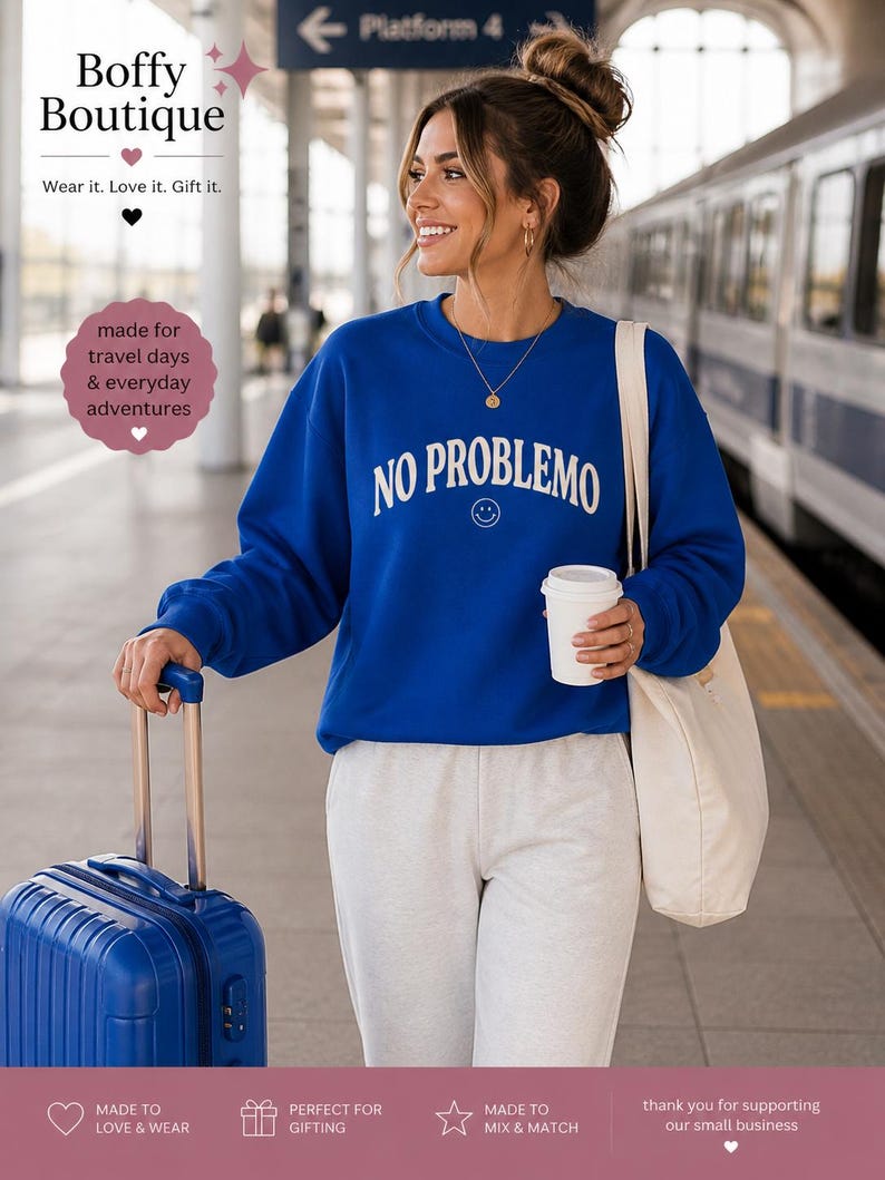 May include: A woman wearing a royal blue sweatshirt with the words "NO PROBLEMO" in white, paired with gray sweatpants. She is holding a white coffee cup and a cream-colored tote bag. A blue suitcase with a retractable handle is visible. The image includes the text "Boffy Boutique".