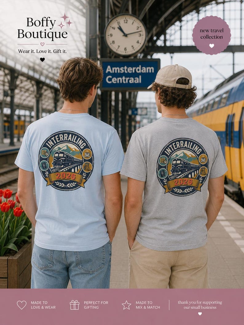 May include: A light blue t-shirt and a grey t-shirt, each featuring a circular graphic on the back. The design includes a train, mountains, and the text "INTERRAILING 2026" surrounded by small icons of a map, passport, coffee cup, and camera.