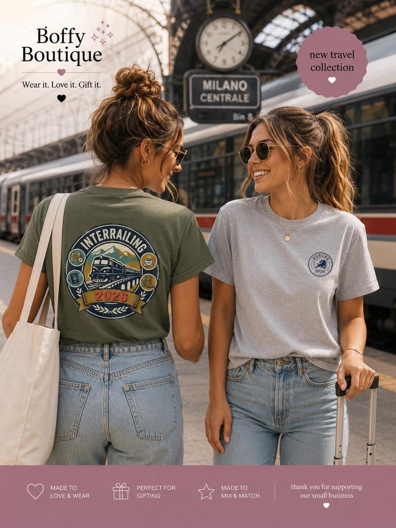 May include: An olive green t-shirt featuring a large circular graphic on the back with a train, mountains, and the text "INTERRAILING 2026" and a light gray t-shirt with a small circular "EUROPE 2026" logo on the front left chest area.