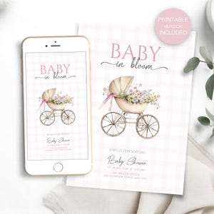 May include: A baby shower invitation with a watercolor illustration of a vintage baby carriage filled with flowers. The invitation is displayed on a smartphone and a printed card, both with the text "Baby in Bloom."