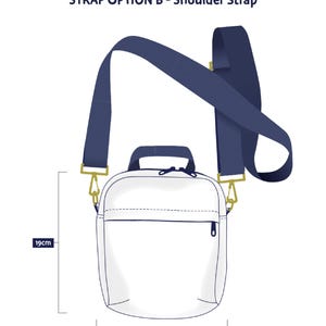 May include: A white shoulder bag with a navy blue strap and gold-colored hardware. The bag is 19 cm high and 16 cm wide. The text "STRAP OPTION B - Shoulder Strap" is at the top.