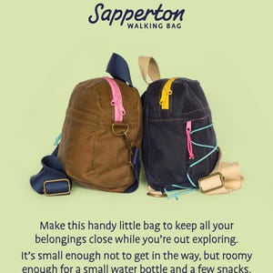 May include: Two small, waxed canvas walking bags. One is brown with a pink zipper and blue straps, the other is navy with a yellow zipper and pink accents. The bags have the text "Sapperton WALKING BAG" at the top.