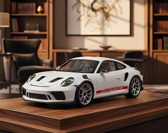 May include: A white sports car model with red detailing and "GT3 RS" text, presented on a wooden plinth. The car features a rear spoiler and detailed wheels. A bookshelf and artwork are visible in the background.