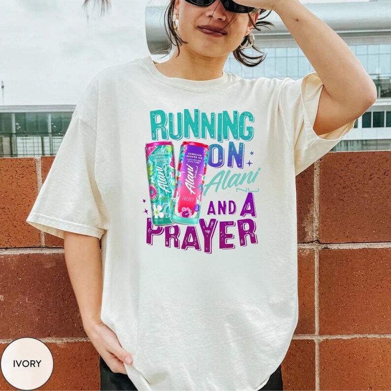 A person wearing a white t-shirt with a colorful graphic design and text printed on it.