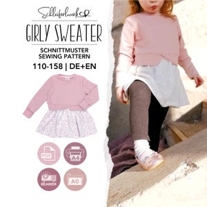 Könnte beinhalten: Ein Schnittmuster für einen Pullover mit langen Ärmeln und angesetztem Rockteil, beschriftet mit GIRLY SWEATER, SCHNITTMUSTER SEWING PATTERN, 110-158 | DE+EN. Das Muster enthält PDF, A4, A0 und Beamer-Formate für die Größen 110-158 in Deutsch und Englisch.