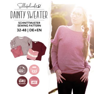 May include: A sewing pattern for a long-sleeved jumper titled Dainty Sweater by Schleiferwerk. The pattern includes sizes 32-48 in German and English. The image displays four variations of the jumper in pink, maroon, and grey, along with PDF, A4, A0, and beamer icons.