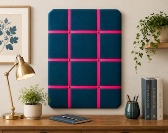 Teal fabric noticeboard with hot pink ribbon in a modern square design. Holds memos, photos, notes and more. Handmade with local fabric.