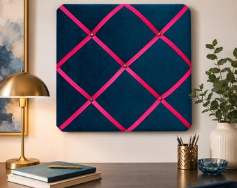 Small teal fabric noticeboard with hot pink ribbon. Holds memos, photos, notes and more. Handmade at home by me!