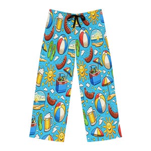 May include: Light blue pajama pants with a repeating pattern of beach balls, sausages, beer mugs, smiling suns, and coolers. The pants have a black drawstring and are made of a soft, comfortable material.