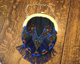 Exquisite lined Beaded Handbag in shades of blue, Colorful Flowers, 1920’s. Celluloid Frame and handle in very good to excellent condition.