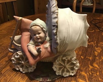 RARE Heubach Baby in Buggy, on Pillow, Flowers on Wheels, Bisque Porcelain, c.1930’s, Excellent Condition