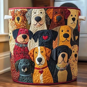 May include: A cylindrical fabric storage basket featuring a patchwork design of various dog breeds. The dogs are depicted with detailed facial features and colorful patterns. The basket has a red trim and white handles.