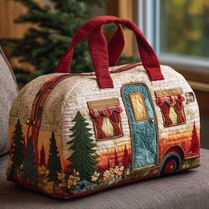 May include: Quilted travel bag with a camper design. The bag has a red handle and zipper, with a detailed applique of a camper, trees, and flowers. The colour palette includes shades of red, green, orange, and blue.