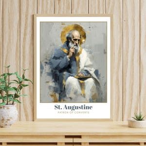 Op de afbeelding: Een ingelijste prent van St. Augustinus, patroonheilige van de bekeerlingen. Het kunstwerk toont een zittende, oudere man met een witte baard en een gouden halo. Hij draagt een blauw en wit gewaad. De prent zit in een houten lijst.