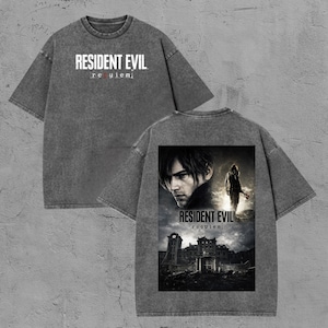 May include: Grey t-shirt with the text "RESIDENT EVIL requiem" on the front. The back of the shirt features a graphic of a man and a building with the words "RESIDENT EVIL requiem".