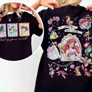 May include: Black t-shirt featuring a colorful graphic design from the movie "The Little Mermaid." The front of the shirt has three rectangular images with characters and the text "Part of your world." The back has a larger design with Ariel and other characters.
