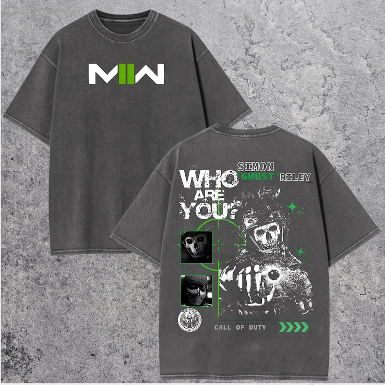 May include: Dark gray t-shirt with the text "MW" in white and green on the front. The back of the shirt features a graphic of a skull-faced soldier with the text "WHO ARE YOU?" and "SIMON GHOST RILEY". The shirt also has the text "CALL OF DUTY".
