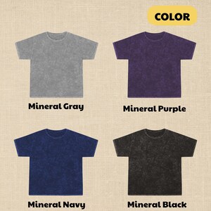 May include: Four mineral wash t-shirts in gray, purple, navy, and black are displayed. Each shirt is a crew neck with short sleeves. The text "Mineral Gray", "Mineral Purple", "Mineral Navy", and "Mineral Black" is printed below each shirt.