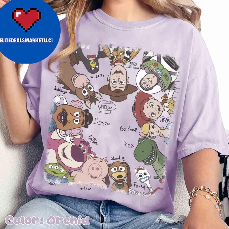 May include: Orchid-colored t-shirt featuring a graphic of various Toy Story characters, including Woody, Buzz Lightyear, and Jessie. The characters are arranged in a playful design with their names written below. The text "ELITEDEALSMARKETLLC!" is in the upper left corner.