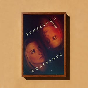 May include: A framed rectangular poster featuring a dark, starry space background with two mirrored, overlapping faces of a person. The word COHERENCE is printed in white capital letters twice, once right-side up and once upside down in the corners.