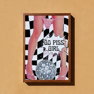 May include: Framed art print featuring a pop art style image. The artwork depicts legs in pink heels and underwear, with a disco ball and the text "GO PISS GIRL" on a black and white checkered background.