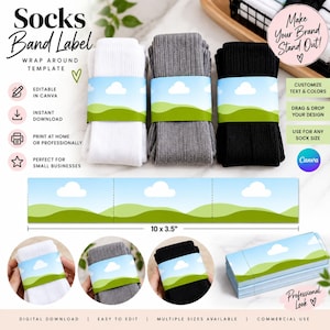 May include: A digital template for a socks band label measuring 10 by 3.5 inches, featuring a blue sky with white clouds and green hills. The set includes white, grey, and black ribbed socks wrapped in the label, with text overlays describing Canva editing, instant download, and printing options.