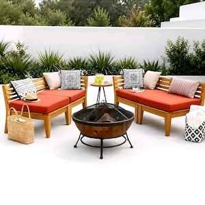 May include: An outdoor patio set featuring two wooden benches with bright orange cushions, patterned throw pillows, and a round side table. A circular metal fire pit with a mesh screen sits in the center, accompanied by a woven tote bag and a patterned bin.