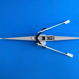 May include: A rustic wooden sign with the text "Welcome to our home" in white lettering. The sign features a distressed finish and a simple, inviting design, perfect for entryway decor.