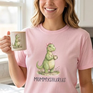 May include: A set of three ceramic mugs with a speckled, matte finish. The mugs are in shades of cream, light gray, and dark gray. Each mug has a simple, minimalist design, perfect for coffee or tea.