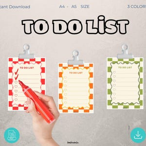 May include: Three colourful "To Do List" printable templates. Each list is clipped to a silver clip. The lists have a checkered border in red, orange, and green. The text "To Do List" is at the top of each list. A red marker is shown marking the list.