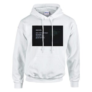 May include: A white ceramic mug with a black handle and the text "But First, Coffee" in a black, handwritten-style font. The mug is on a white surface.