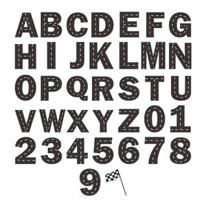 May include: A complete set of uppercase letters from A to Z and numbers from 0 to 9, designed with a dark gray asphalt texture and white dashed road markings. A small black and white checkered racing flag is positioned next to the number 9.