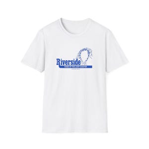 May include: White t-shirt with a blue graphic that reads "Riverside" above a roller coaster design. Below the word "Riverside" is the text "HOME OF THE LOOP COASTER" and "AGAWAM, MASS."