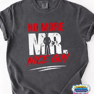 Peut inclure: T-shirt gris foncé avec l'inscription "NO MORE MR. NICE GUY" en rouge et blanc. Le design comprend une silhouette d'une personne. Le t-shirt a un aspect vintage et usé.