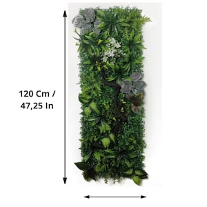 May include: Rectangular artificial vertical garden panel, 47.25 inches tall and 15.75 inches wide, featuring a variety of green foliage, including ferns and other plants. A dark brown branch adds a natural touch. Some gray and white flowers are also present.